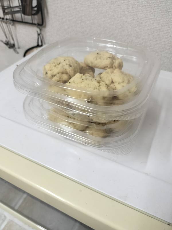 Homemade scones stored in a reused kimchi container for easy fridge storage