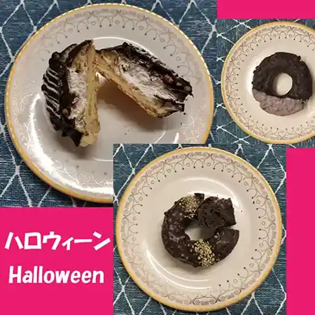 Three limited-edition Halloween donuts from Mister Donut Japan, featuring rich chocolate and playful seasonal designs on a plate.