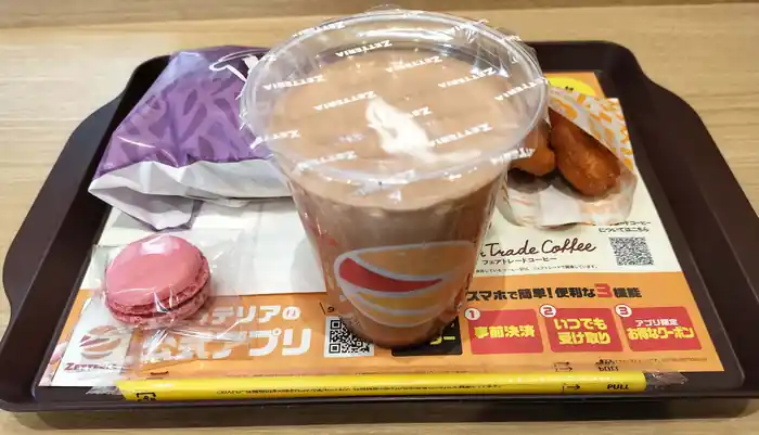 Zetteria meal tray with a chocolate shake, fried chicken, and a macaron at a Japanese fast-food restaurant