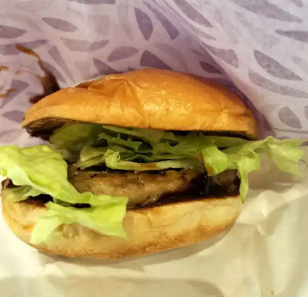 Teriyaki beef burger from Zetteria, a Japanese burger chain, served with fresh lettuce and a soft bun